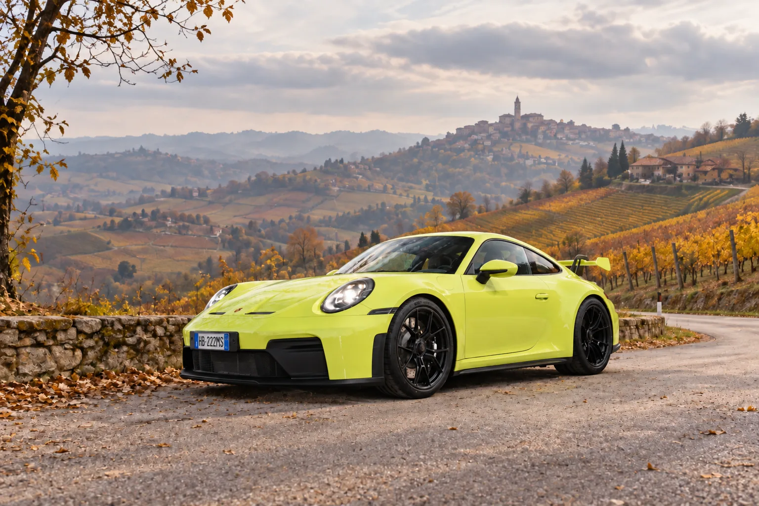 Yellow Porsche 911 GT3 in Roero with visible registration plate; illustrative visual